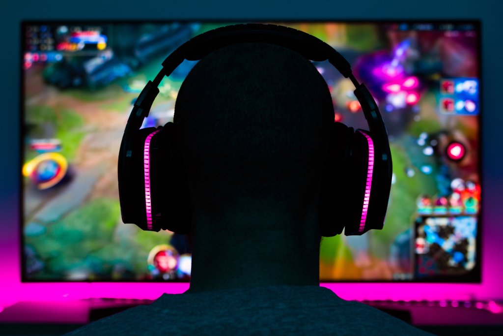QA tester evaluating gameplay on a monitor during functional and localisation quality assurance testing.